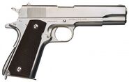 A nickel-plated M1911A1 in real life, without the suppressor.