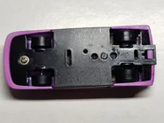 Purple Resin base view, with a coiled metal piece visible through hole