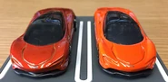 A front view of the metalflake orange Hot Wheels McLaren Speedtail (left) and the orange Tomica McLaren Speedtail (right, 1/68)