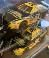 ...Pit Crew has White headlights, Daytona 500 has Detailed headlights. Also note the White Racing Lines on both cars are different.