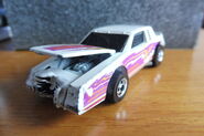 Hot Wheels 1986 2557 Crack-ups Knocker Stocker Buick Regal white with yellow, orange, purple Stripes 'Zap' made in Malaysia d