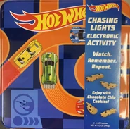 Christmas cookie tin. Lid is a memory game. As the sounds and headlights go off, you have to press the buttons on the roof in the same order to win.