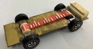 Prototype of a "Music Car"! As the wheels spin, a pick will hit the slot. The vibrations will create music as the car runs down the track.