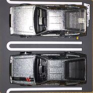 A top view of the Hot Wheels 1981 DeLorean DMC12 (2021 Boulevard, top) and Hot Wheels 1981 DeLorean DMC12 (2014 Speed Team, bottom)