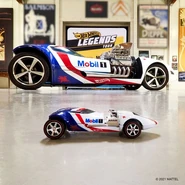 Mobil 1 HW FB Promo.jpg (53 KB) Promotional Image used for the Hot Wheels x Mobil 1 Promotion. The 1/64 version (with the wrong wheels) next to the 1:1 version you can see at the HW Legends Tour show