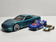 BasicFunKeyChainCarSizeComparison.jpg (1.1 MB) Size Comparison to an Atomix car and a regular 1:64 scale car.