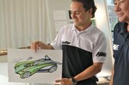 Felipe Massa showing the final sketch with Alton Takeyasu