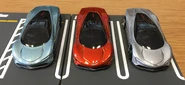 A front view of the Hot Wheels McLaren Speedtail from left to right: metalflake light blue, metalflake orange, metalflake gray