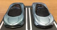 A front view of the metalflake light blue Hot Wheels McLaren Speedtail (left) and the gray-blue Tomica McLaren Speedtail (right, 1/68)