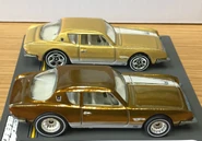 A side view of the 2011 Hot Wheels Studebaker Avanti: Super Trea$ure Hunt$ (front) and Regular Treasure Hunt (back)