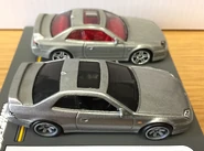 A side view of the 2020 Hot Wheels ’98 Honda Prelude silver (top) and 2021 metalflake silver (car culture, modern classics, bottom).