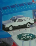Unreleased plain white version with Corgi2 wheels seen on the 1997 Ford Dealership's box.