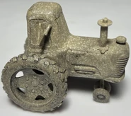 HolsteinHeiferTrackPiece.jpeg (686 KB) Holstein Heifer Tractor from single-lane track piece flip mechanism with rivet used as exhaust pipe