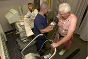An elderly patient taking a treadmill stress test, via Wikipedia