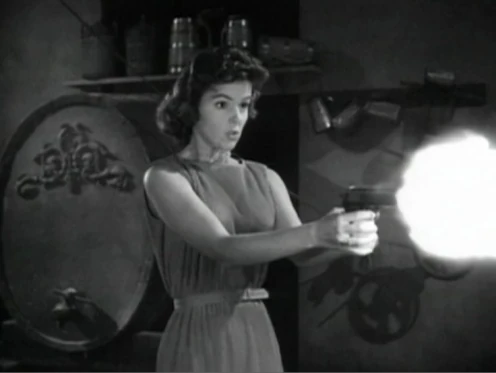 Nora Manning firing her Colt Model 1903 Pocket Hammer pistol.