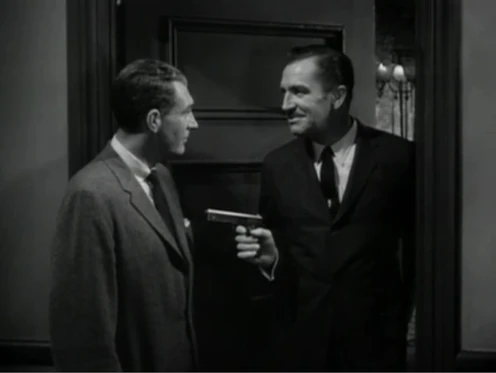 Frederick Loren points his Colt Model 1903 Pocket Hammer pistol.