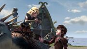 Hiccup having just handed Astrid something