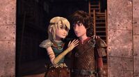 Astrid having put her right hand on Hiccup's shoulder