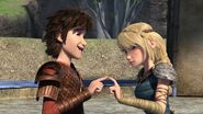 Hiccup and Astrid touching fingers