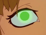 Jennifer's eyes glow in a brighter shade of green