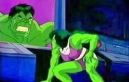 She-Hulk looking at Hulk on the screen