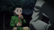 Gon eating and talking with Meleoron