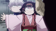 Killua being defended by Alluka