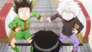 Wing catches Gon and Killua on their way to Hisoka's match