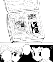 Gon and Killua discovering the three items left behind by Ging