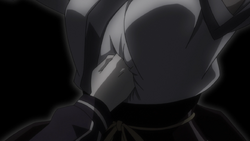 Machi preventing Killua's hand from piercing further