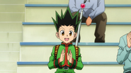 Gon cheers Killua on the sidelines