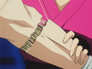Machi repairs Hisoka's broken arm