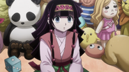 Alluka looks up as Killua enters her room