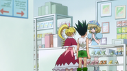 Gon and Biscuit talk to the Spell Card Shop NPC