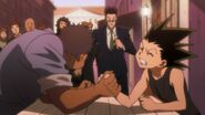 Gon makes money by arm wrestling