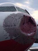 Severe hail damage to a plane.