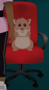 Dr. Cheeks sitting on a red chair.