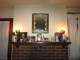 Okay this is a little blurry but this is our fireplace mantle! See I like the mirror up dere...