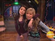 Carly throws her arm around Sam on iCarly