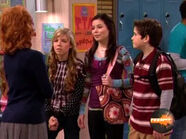 Carly and Sam shoulder to shoulder in front of Miss Briggs