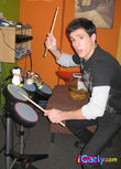 Griffin plays the drums
