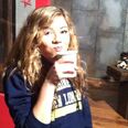 Jennette drinking a cup of coffee in between takes on-set