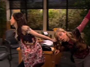 Carly pulls Sam away from the computer by her hair