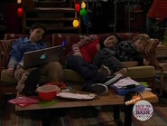 Carly and Sam sleeping together with Freddie positioned away on the couch