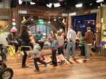 The cast signing autgraphs for fans on the iCarly Studio set