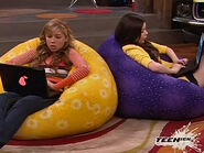 Carly and Sam mirroring each other on the bean bag chairs