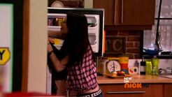 Carly grabbing Sam to pull her out of the freezer