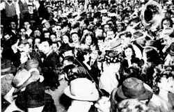 Crowd greets Stampeders at the train station after winning the cup.