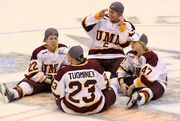 Murray and her Bulldogs teammates relaxing on the ice after winning the 2010 NCAA Frozen Four championships over the Cornell Big Red
