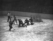 Action from Game 2 of the 1950 Semi-finals. #9 Pentti Lund, Elmer Lach, #15 Gus Kyle, Frank Eddolls, Chuck Rayner, April 1, 1950.